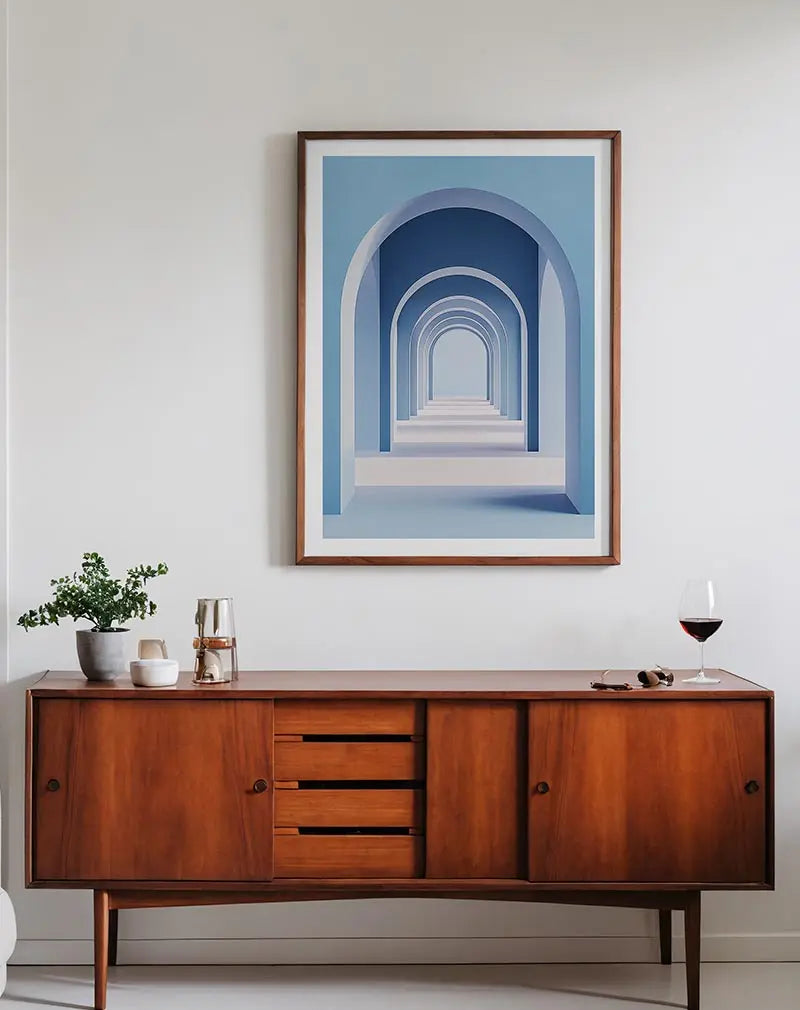 Minimalist design of a series of blue archways creating an infinite perspective. Perfect wall art for adding a modern and serene touch.